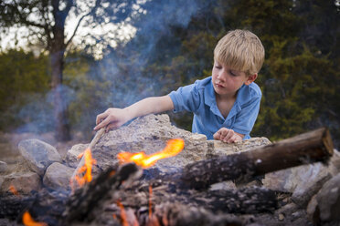 USA, Texas, Boy at camp fire - ABAF001201