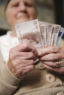 Senior woman holding euro notes - JATF000663