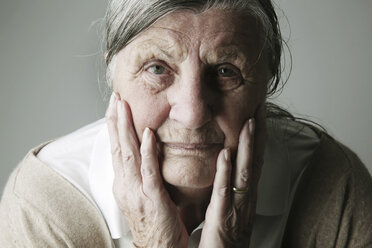 Portrait of senior woman with head in her hands - JATF000637