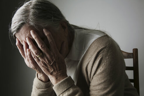 Senior woman covering face with her hands - JATF000651