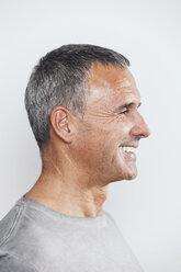 Profile of smiling mature man, studio shot - MFF000844
