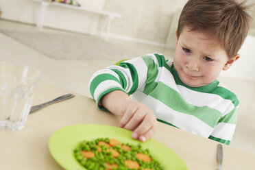 Germany, Munich , Boy doesn't want to eat peas and carrots - FSF000145