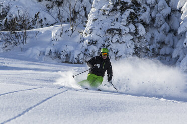 Germany, Bavaria, Sudelfeld, Skier in deep powder snow - EGF000012