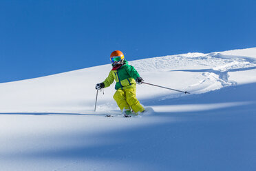 Switzerland, Grisons, Obersaxen, Boy skiing - EGF000046