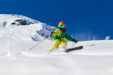 Switzerland, Grisons, Obersaxen, Boy skiing - EGF000048