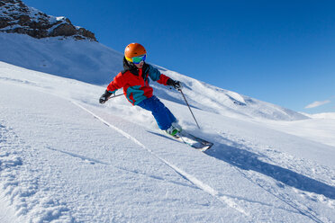 Switzerland, Grisons, Obersaxen, Boy skiing - EGF000055