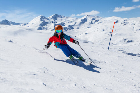 Switzerland, Grisons, Obersaxen, Boy skiing - EGF000056