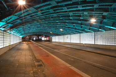 Germany, North Rhine-Westphalia, Cologne, lighted underpass by night - WGF000228