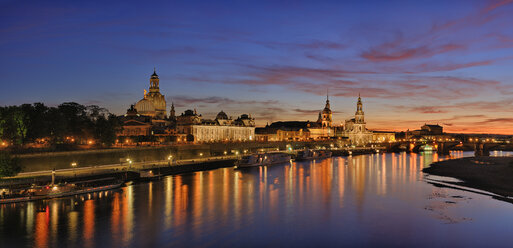 Germany, Saxony, Dresden, view to Elbe river and Dresden skyline at sunset - RUEF001206