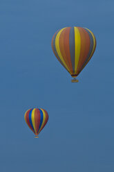 Africa, Kenya, Maasai Mara National Reserve, Two hot air balloons in the sky - CB000274