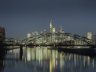 Germany, Hesse, Frankfurt,Germany, View to Osthafenbruecke and skyline with financal district at night - AMF001842