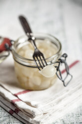 Pickled silverskin onions in glass jar and fork - SBDF000599