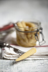 Pickled baby corn in preserving jar and fork - SBDF000616