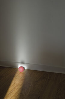 Pink rubber ball on wooden floor - MUF001425