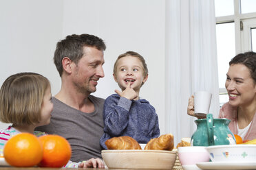 Family of four having healthy breakfast - RBYF000443