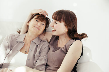 Portrait of mother and daughter laughing together - MFF000902