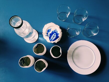 Blue table set with different cups, glasses and plates - MEAF000140