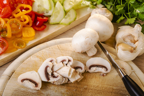 Chopped champignon on chopping board stock photo