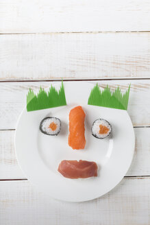 Sushi garnished on plate as a funny face - DRF000532