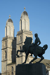 Switzerland, Zurich, view to twin towers of great minster and Hans Waldmann Monument in front - ELF000896