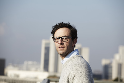 Portrait of serious looking man wearing glasses stock photo