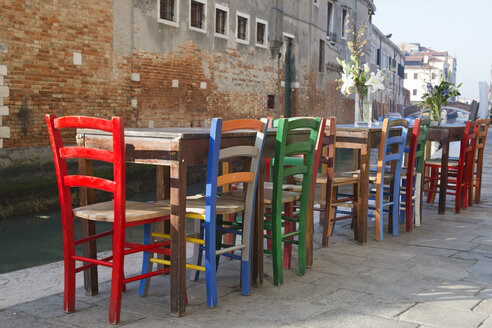 Italy, Venice, Cannaregio, street restaurant at Rio de la Misericordia, empty chairs - LAF000640