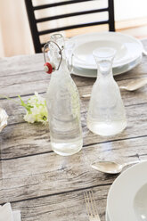Water bottle and carafe on festive laid table - LVF000751