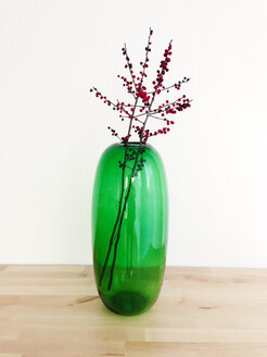 Transparent green flower vase with two twigs of hollies (Ilex aquifolium) - AFF000003