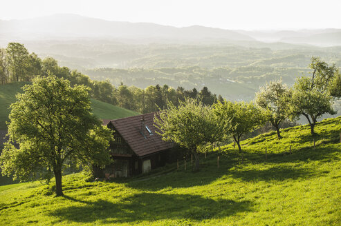 Austria, Styria, Western Styria, Deutschlandsberg, farmhouse on the landscape - HHF004738