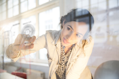 Portrait of young female architect in office - FKF000452