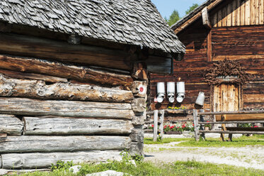 Austria, Salzburg State, Untertauern, Pongau, alpine cabin with milk churns and stable - HHF004756