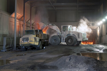 Germany, Steel mill, removal of slag with shovel excavator - SCH000084