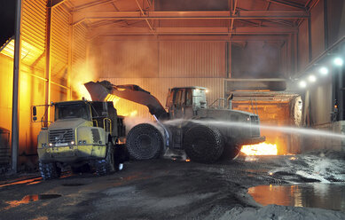 Germany, Steel mill, removal of slag with shovel excavator - SCH000083