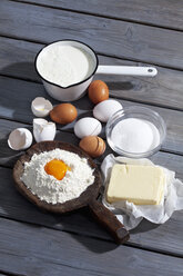 Baking ingredients on grey wooden table - CSF021032