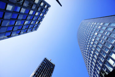 Germany, North Rhine-Westphalia, Dortmund, view to high-rise office buildings from below - HOH000595