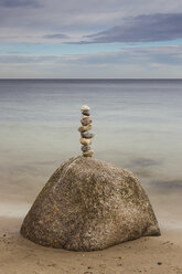 Germany, Brodten, Pile of rocks at beach - SR000441