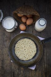 Pancake in frying pan and ingredients, eggs, milk and flour - LVF000885