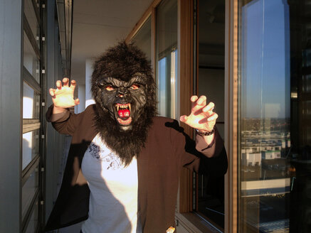 Germany, Berlin, female with gorilla mask - TKF000315