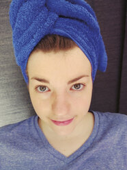 Young woman with towel around her head, Germany - UWF000042