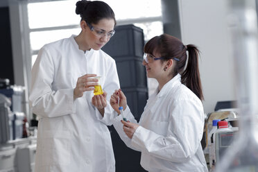 Two young female chemistry students in lab - SGF000479