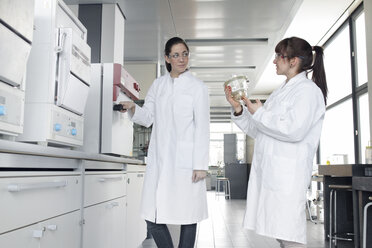 Two young female chemistry students in lab - SGF000485