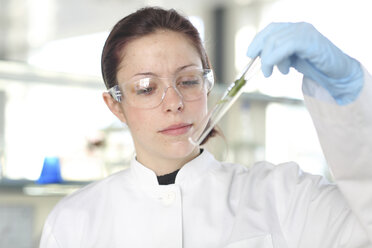 Portrait of young female scientist at work in lab - SGF000460