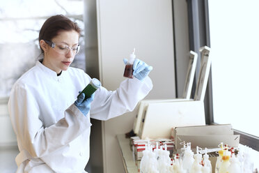 Young female scientist at work in lab - SGF000459