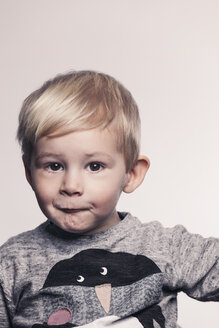 Portrait of little boy pouting a mouth - MFF000922