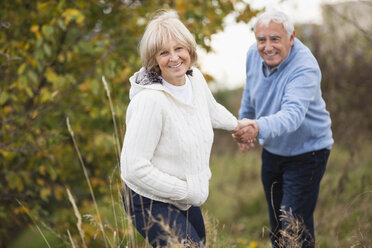 Smiling senior couple on the move - WESTF019225