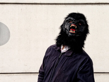 Germany, Berlin, man with gorilla mask - TKF000319