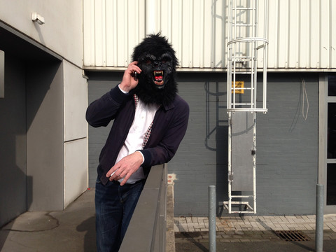 Germany, Berlin, man with gorilla mask stock photo