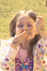 Portrait of little girl with apple peel - SARF000421