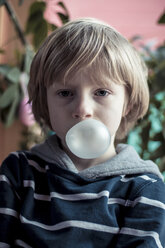 Portrait of little bow blowing gum bubble - SARF000426