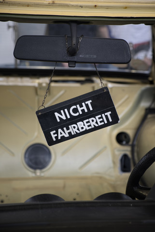 Sign hanging in old car, partial view stock photo